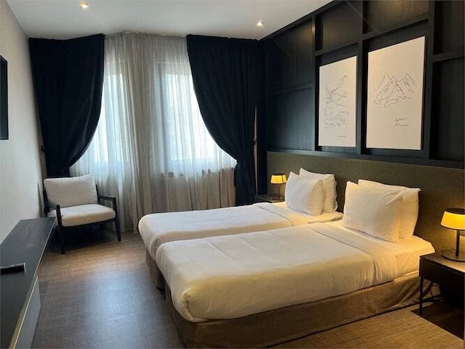 Superior twin room with dark panelled walls